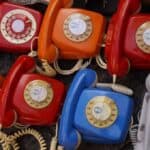 Seven Assorted Colored Rotary Telephones